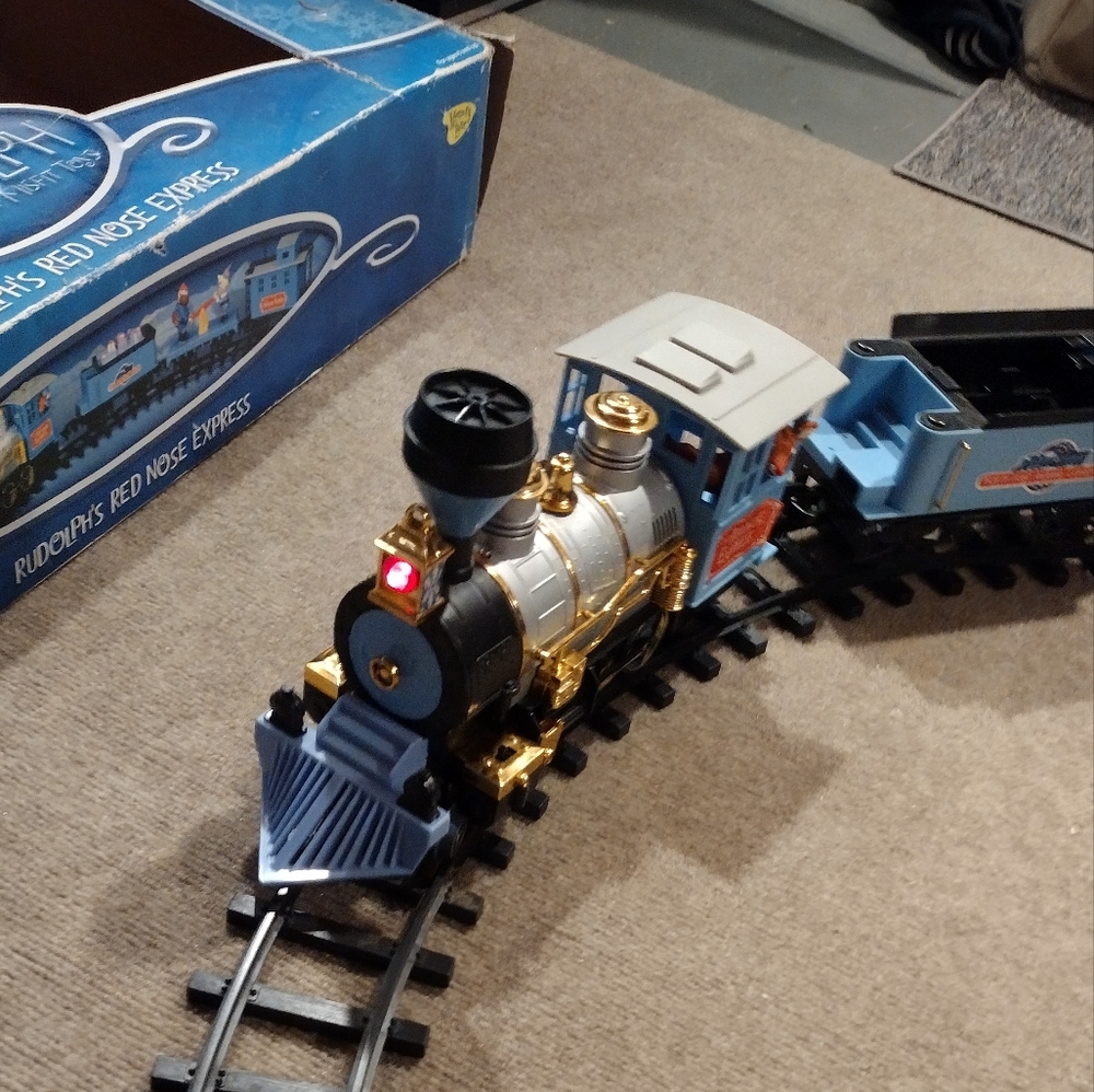 Rudolph and the misfit toys train set working lights definitely a antique